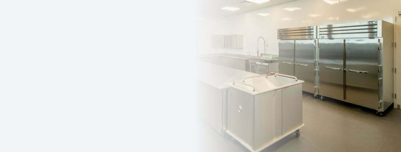 Image depicts commercial appliances in a restaurant kitchen.