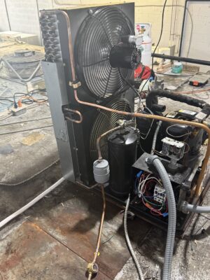 Aging commercial refrigeration condensing unit in a back-of-house area