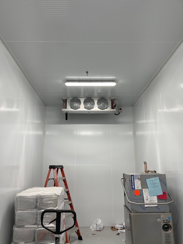 Walk-in cooler interior with a ceiling-mounted evaporator in Toronto