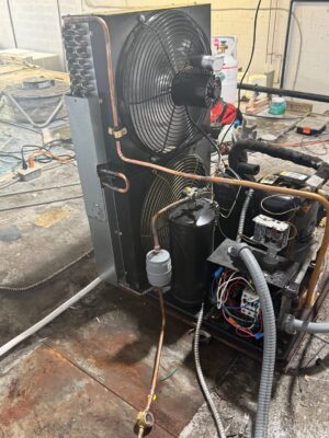 Aging commercial refrigeration condensing unit in a back-of-house area