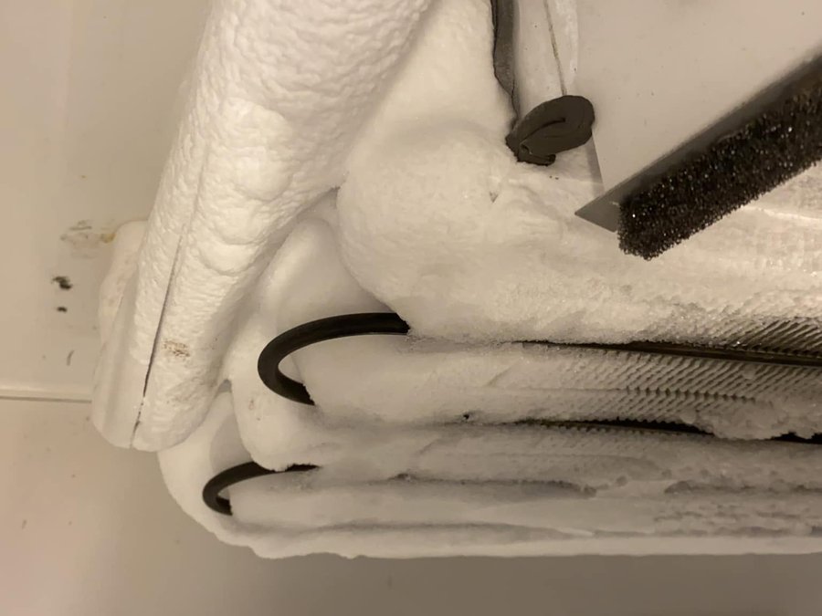 Heavy ice build-up on a walk-in cooler suction line found on an emergency call