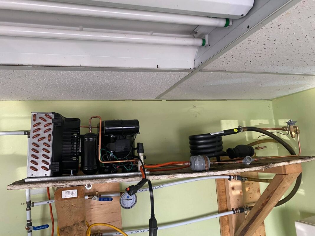 Manifold gauges connected to a condensing unit