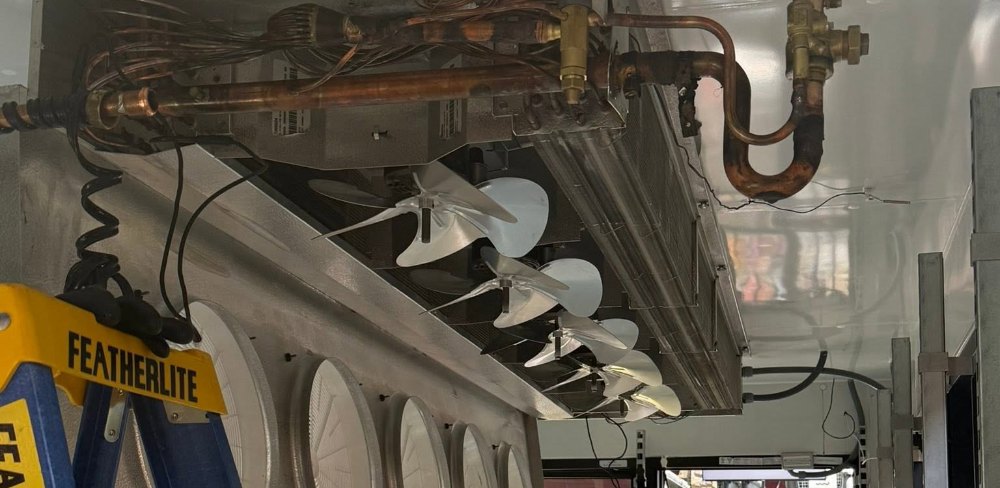 CooperFix access ladder under walk-in cooler evaporator fans in a Toronto store