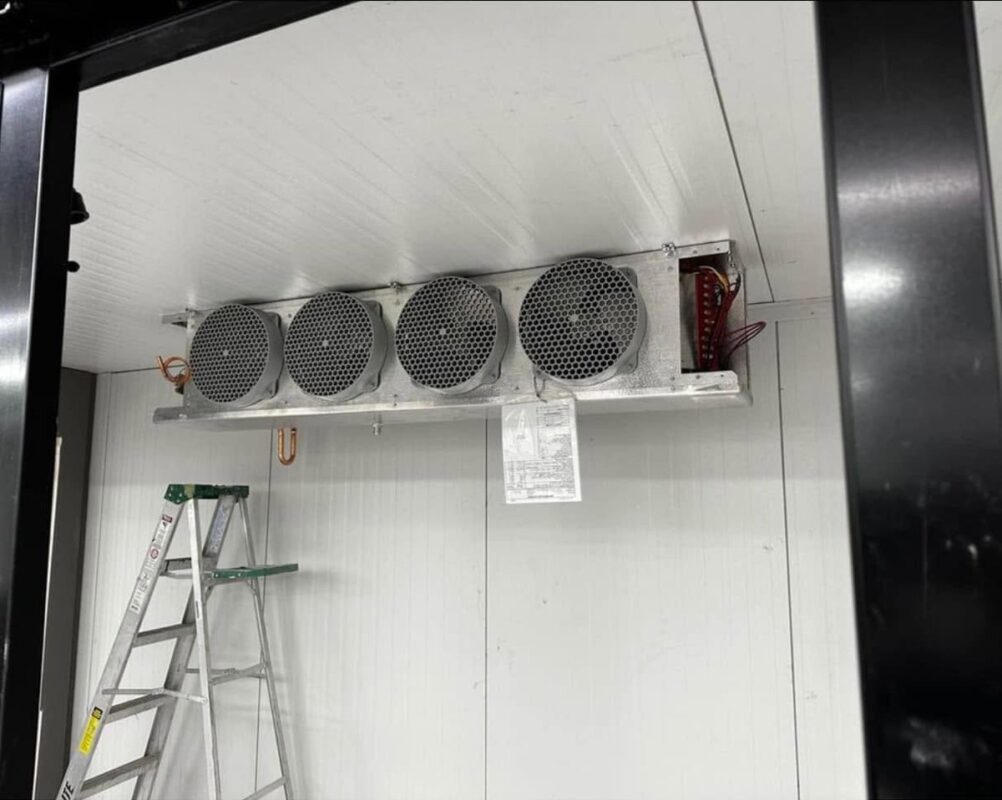 Four-fan evaporator bank inside a walk-in freezer