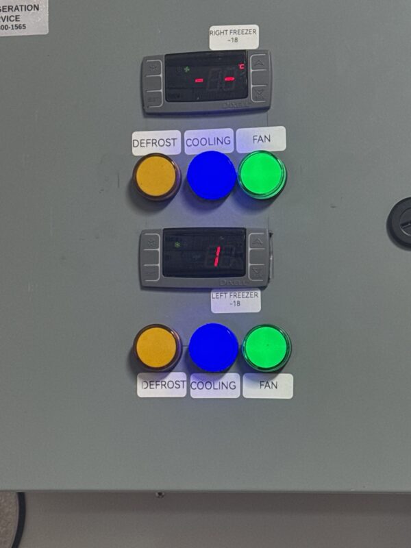 Two digital refrigeration controllers on a freezer control panel