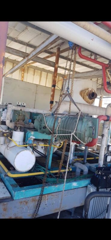 Industrial refrigeration plant room with compressors and pipework, photographed by CooperFix