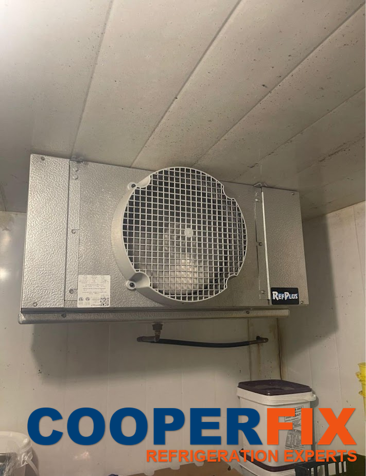 Single-fan evaporator installed inside a cold room.