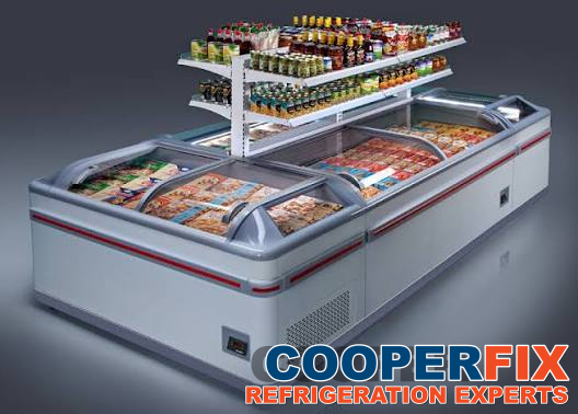 Glass-top island frozen-food display with a raised merchandise shelf.