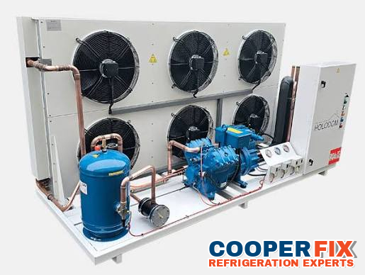 Commercial multi-compressor condensing rack with condenser fans.