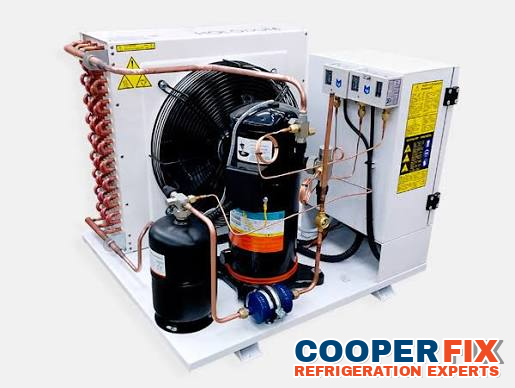 Refrigeration condensing unit with a compressor, fan and connected controls.