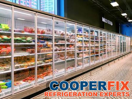 Long commercial glass-door refrigerated meat merchandiser.