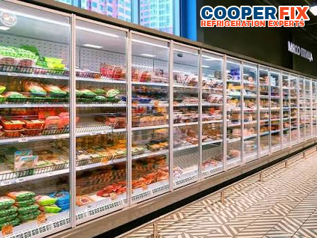 Long commercial glass-door refrigerated meat merchandiser.