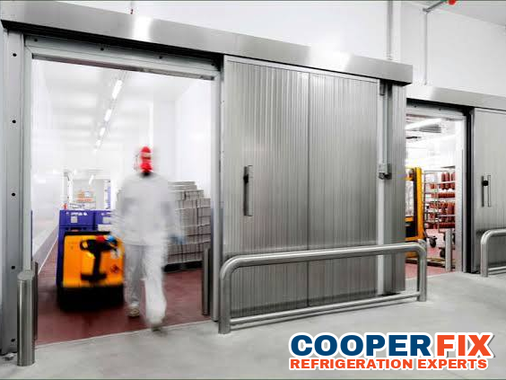 Commercial walk-in cold-storage rooms served by refrigeration equipment.
