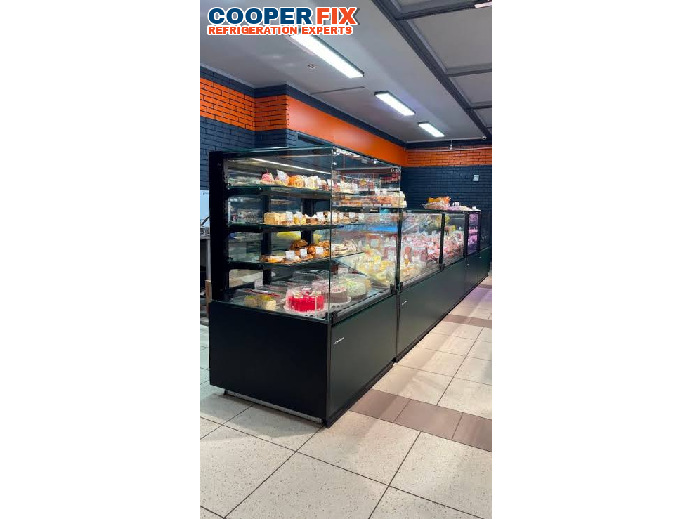 Commercial bakery and deli glass refrigerated display cases.