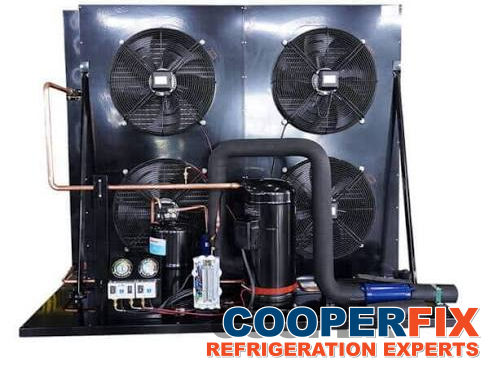 Commercial refrigeration condensing unit with multiple condenser fans.