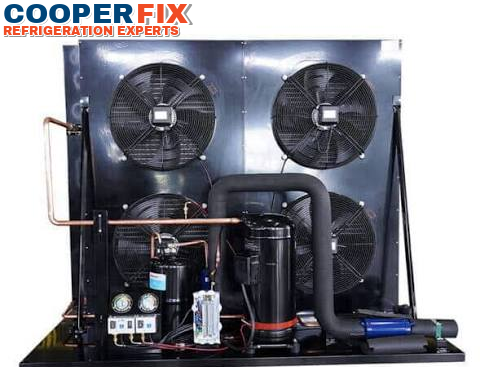 Commercial refrigeration condensing unit with multiple condenser fans.